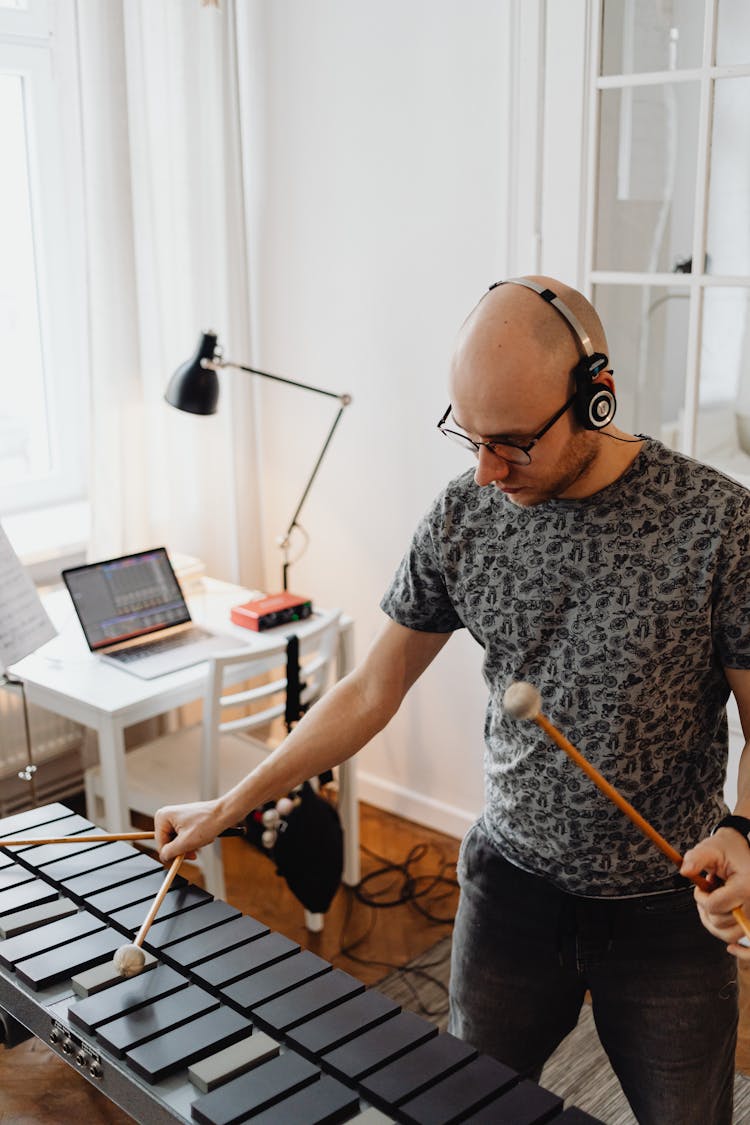 A Man Playing A Xylophone