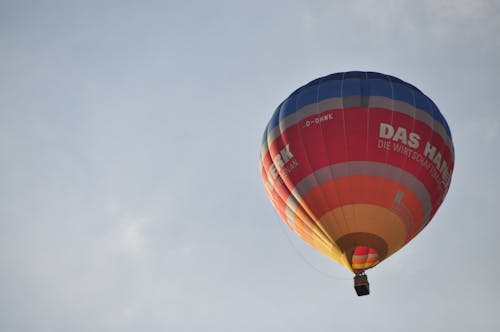 Low-Angle Shot of a Hot Air Balloon Flying in the Sky