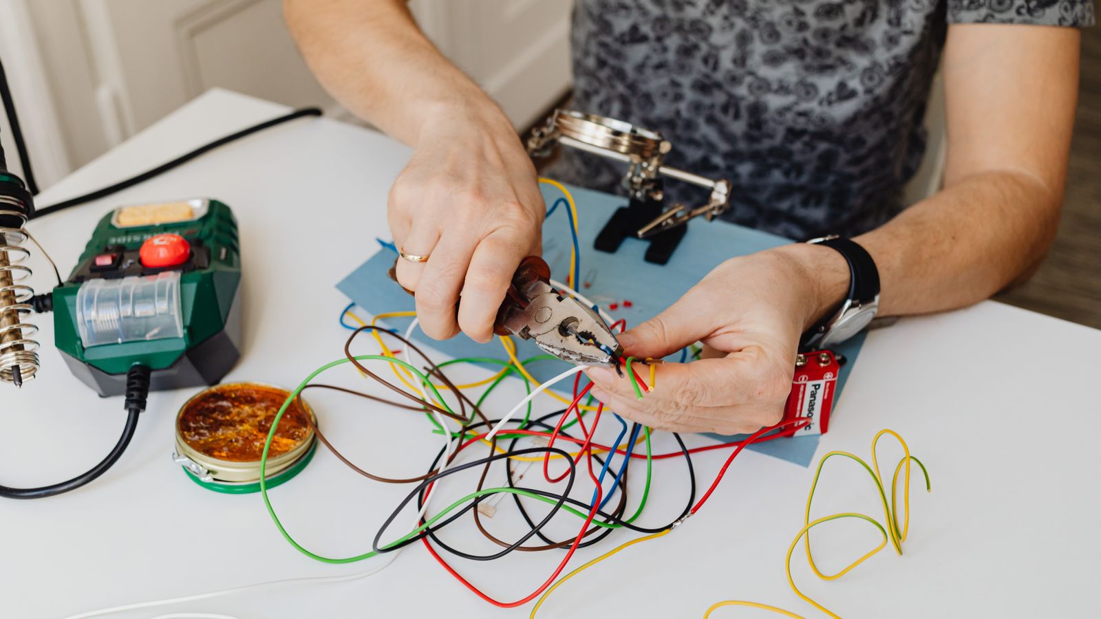 A skilled technician working carefully with electrical wiring
