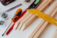Close-Up Photo of Pieces of Wood Near a Screwdriver