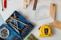 Close-Up Photo of a Measuring Tape Near a Protractor