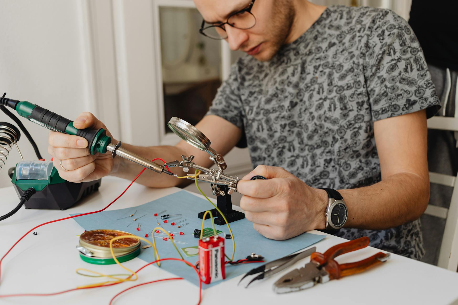 A Man Using a Soldering Iron