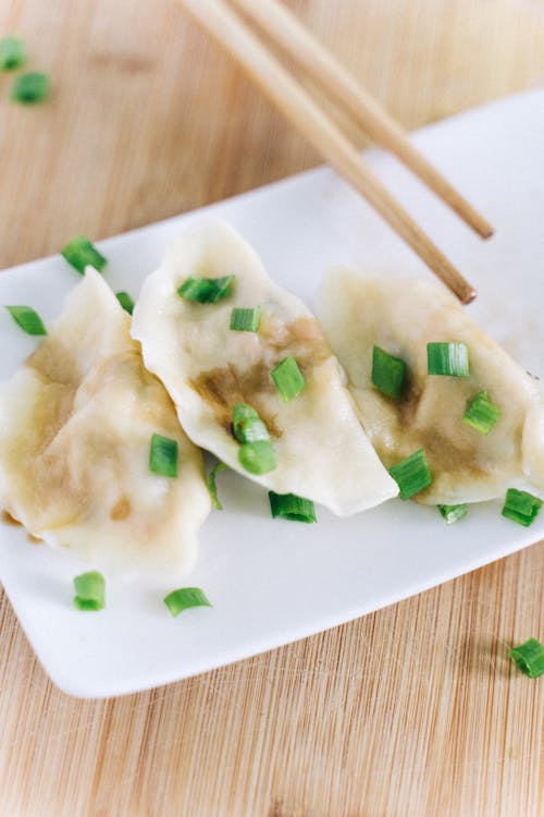 Steamed Dumplings on a Ceramic Plate 