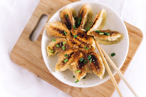 A Fried Dumplings on a Ceramic Plate