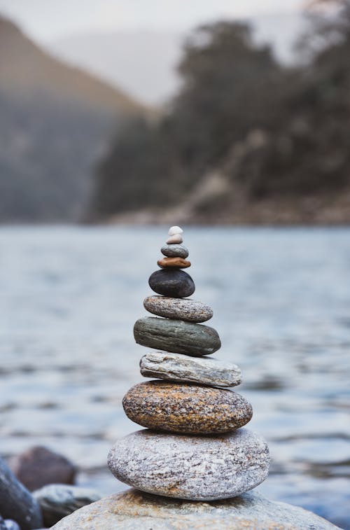 Selective Focus Photo of Stacked Stones 