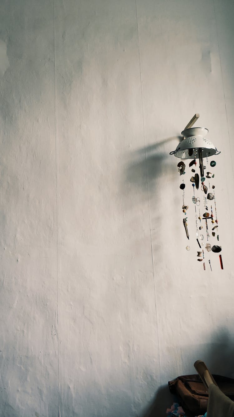 Handmade Wind Chimes Hanging On Light Wall