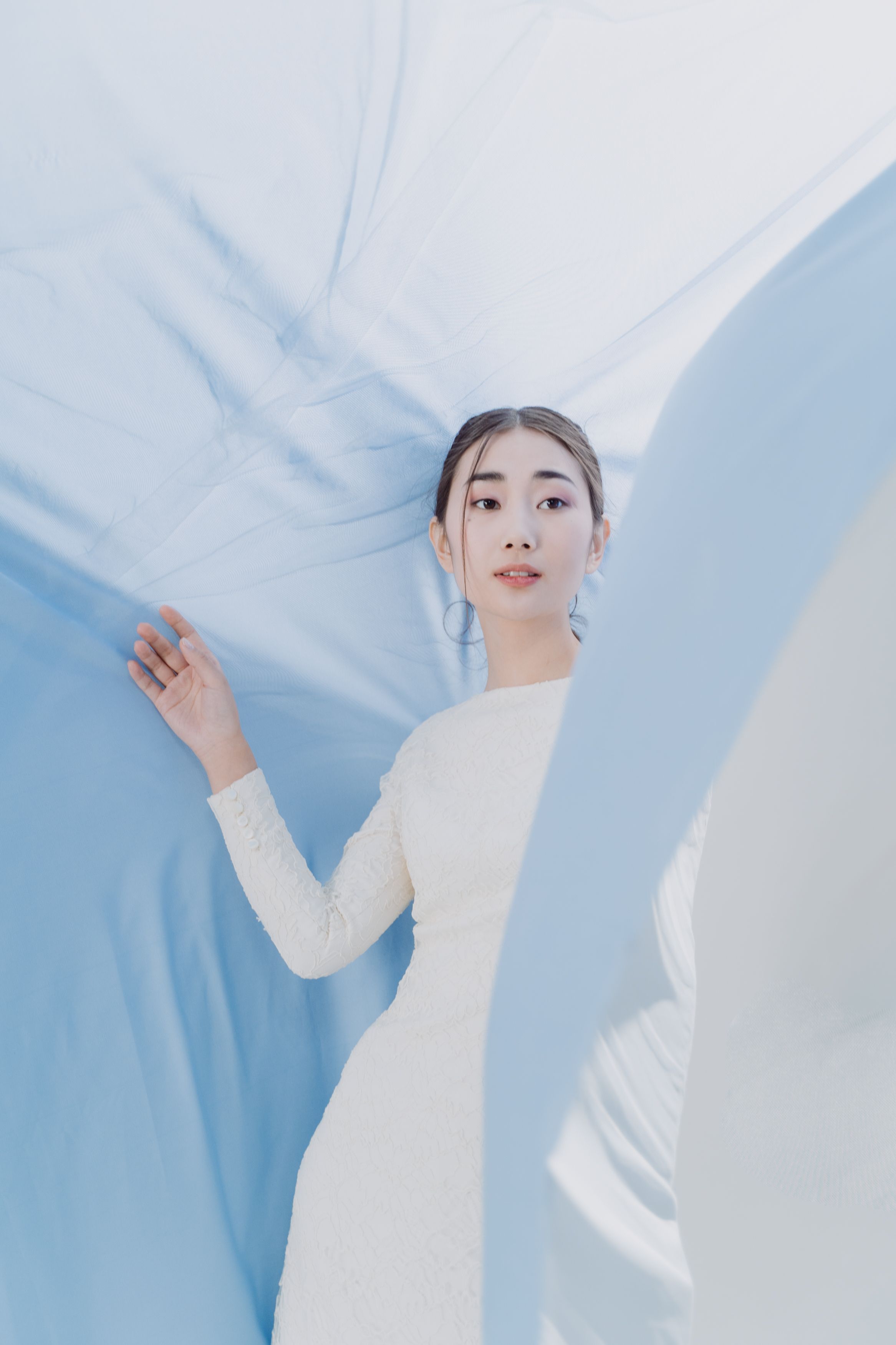 A Woman in White Long Sleeve Dress · Free Stock Photo