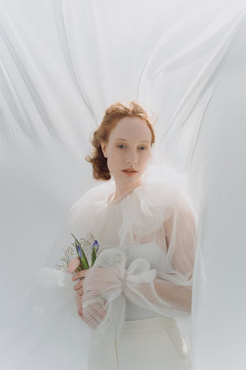 Woman Holding a Bouquet of Flowers