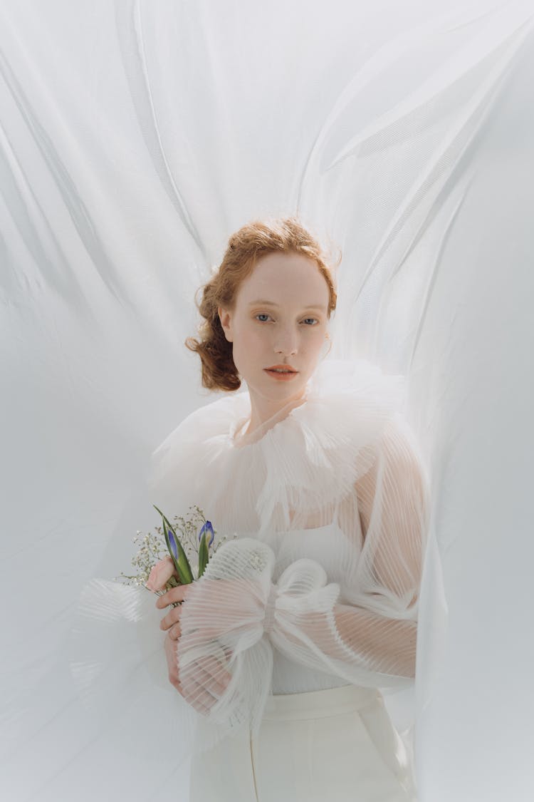 Woman Holding A Bouquet Of Flowers