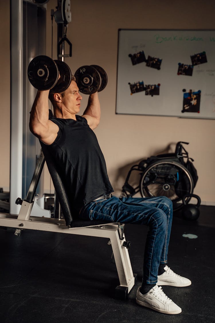 A Man Doing A Dumbbell Shoulder Press