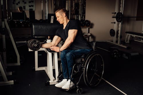 Man in a Wheelchair Lifting Weights