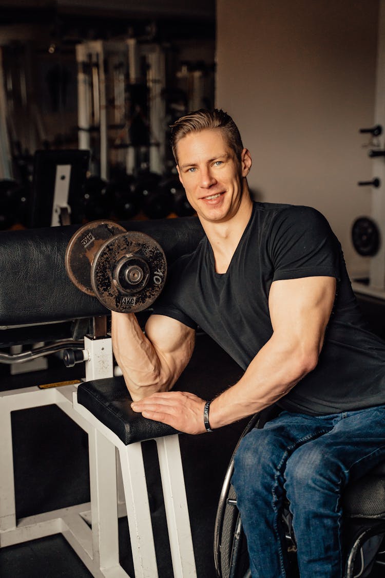 A Man Doing A Dumbbell Bicep Curl