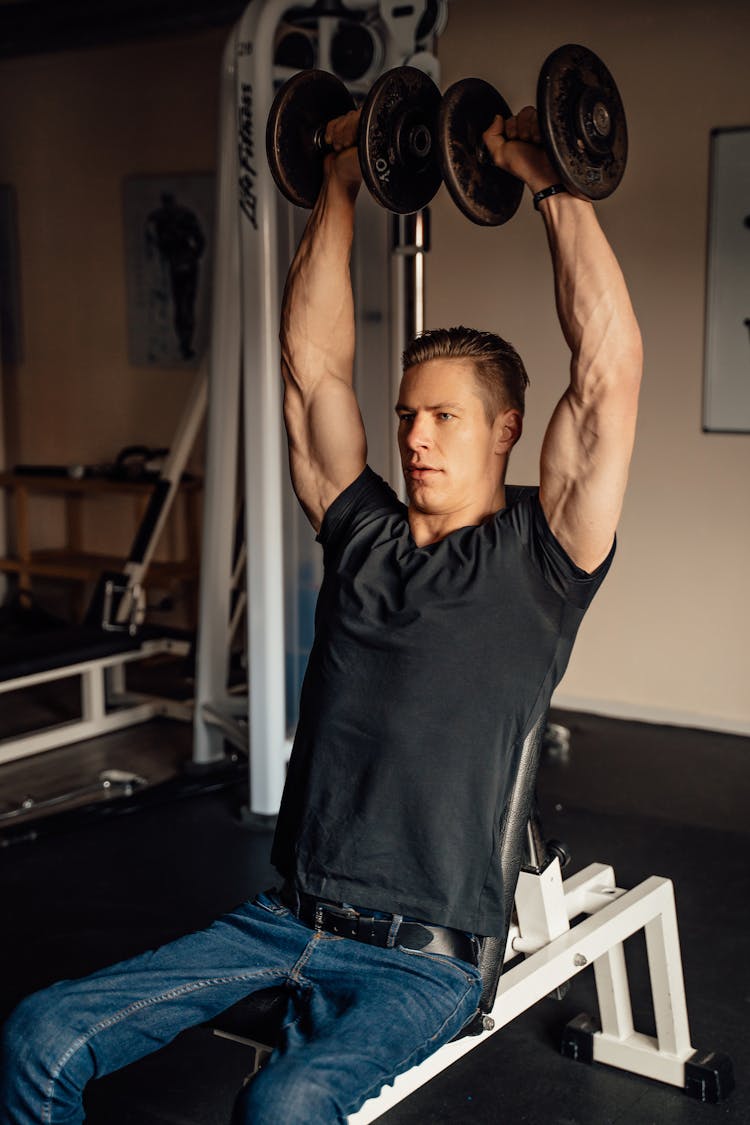 A Man Doing A Dumbbell Shoulder Press