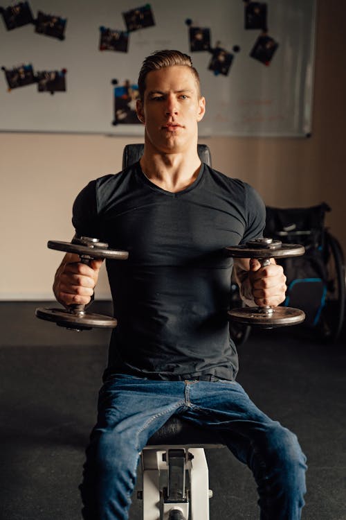 A Man Wearing a Black Shirt Working Out