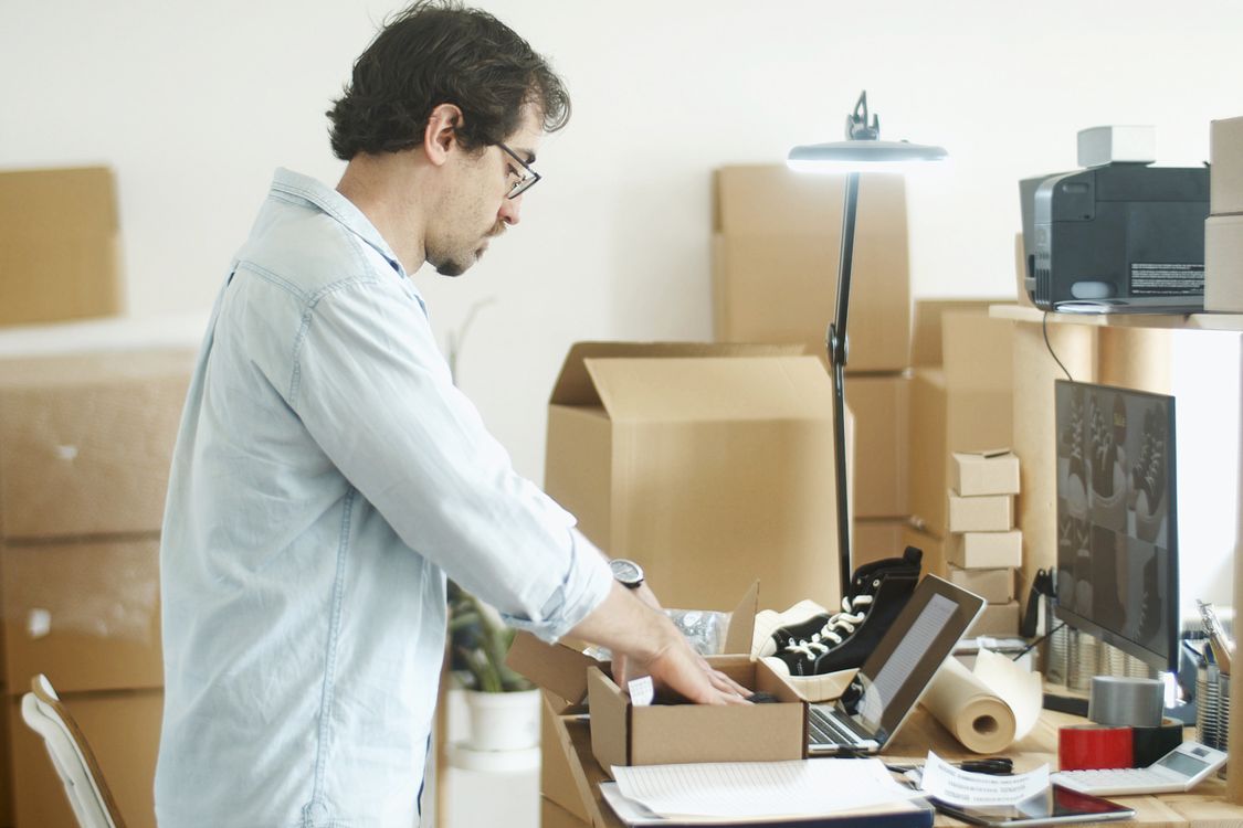 An online seller preparing an item for packing.