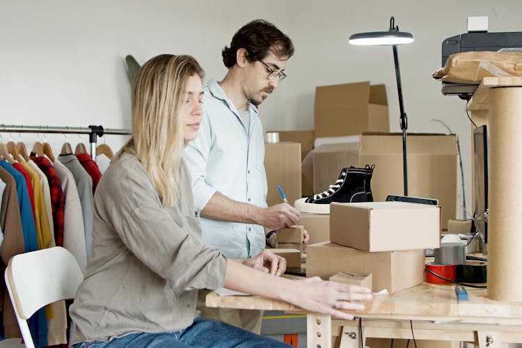 Couple Busy With Packaging Their Products