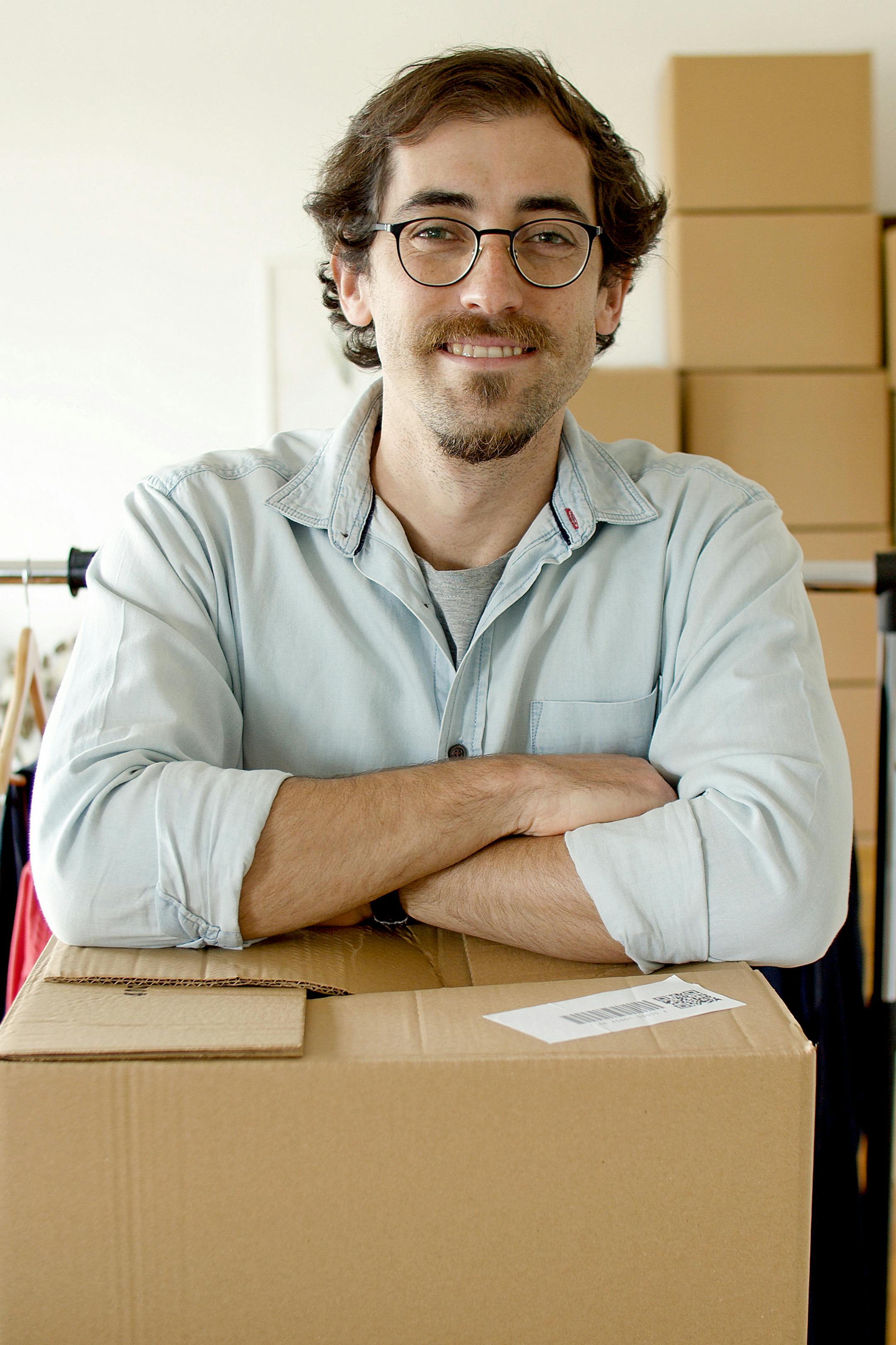 man in gray dress shirt wearing black framed eyeglasses