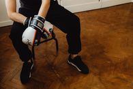 Person Holding White and Black Nike Basketball Shoes