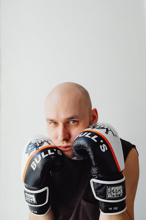 Free A Bald Man Wearing Boxing Gloves Stock Photo