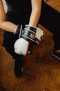 Person Wearing Black and White Boxing Gloves