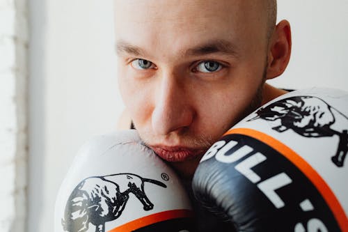 Free A Close-up Shot of a Man Wearing Boxing Gloves Stock Photo