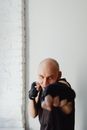 Man in Black Shirt Wearing Black Boxing Hand Wraps