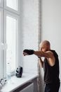 A Man Standing Near the Window
