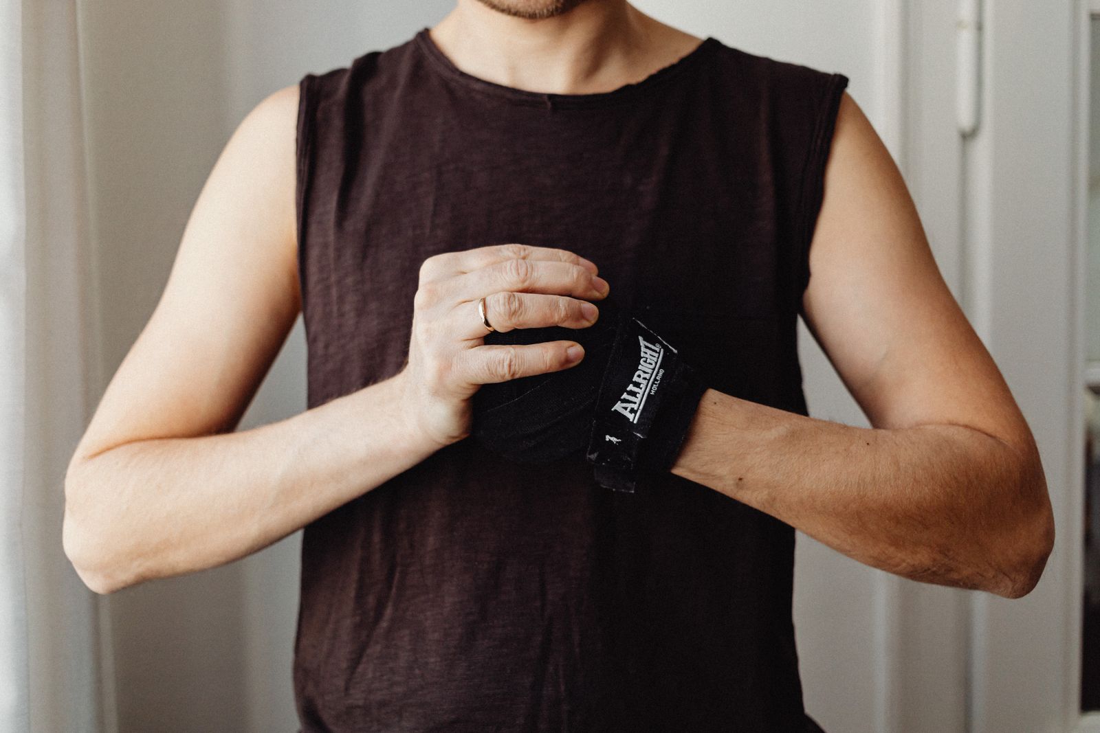 Person using a wrist and thumb support while working at a bright desk