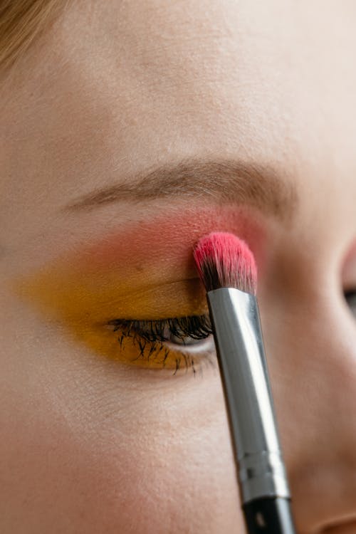 A Close-up Shot of a Person Applying Eyeshadow