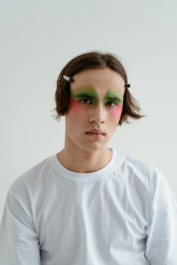 Young Man In White T-shirt With Creative Eye Makeup