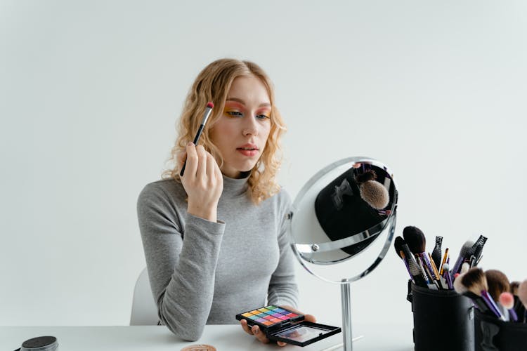 Woman Holding Eye Makeup Brush