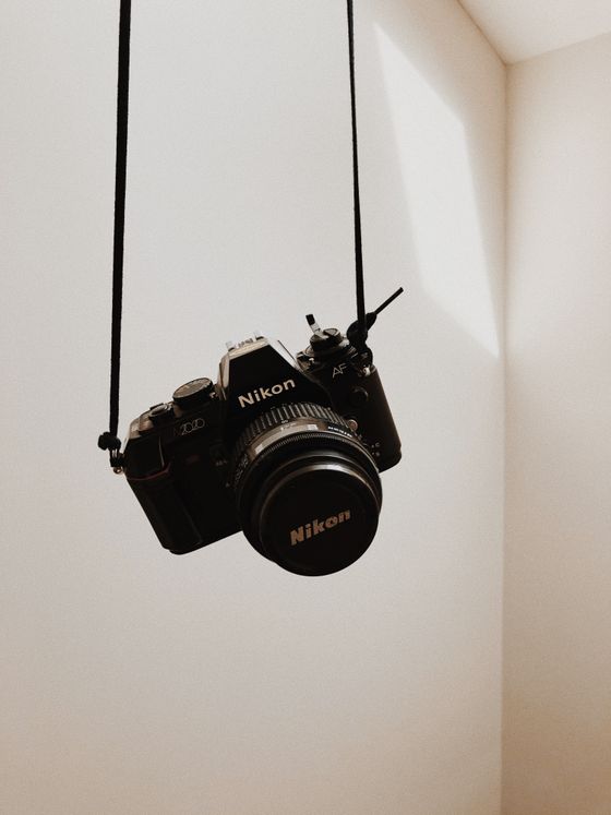 Nikon SLR hanging by its strap