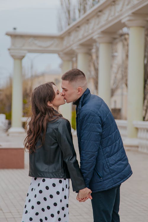 Loving couple kissing on street
