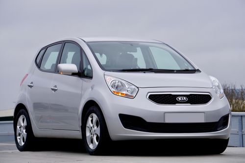 Free Silver Kia hatchback car parked outdoors in the UK with a clear sky backdrop. Stock Photo
