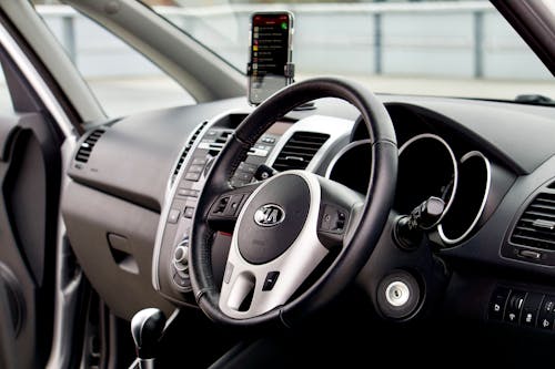 Free A Steering Wheel with Mobile Phone on the Side Stock Photo