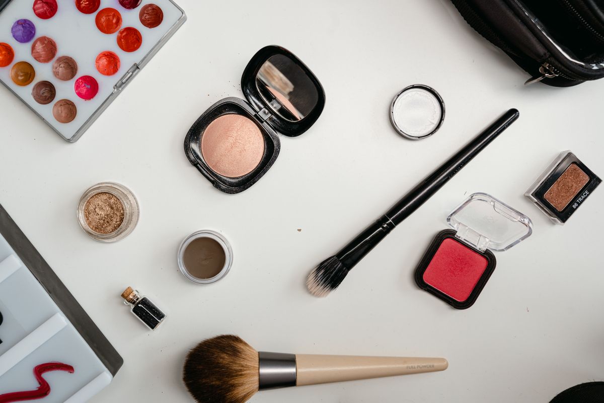 Sephora Credit Card Review - makeup flat lay with brushes and cosmetics