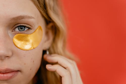 Woman with Yellow Under Eye Patch 