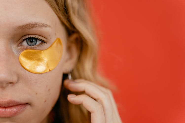 Woman With Yellow Under Eye Patch 