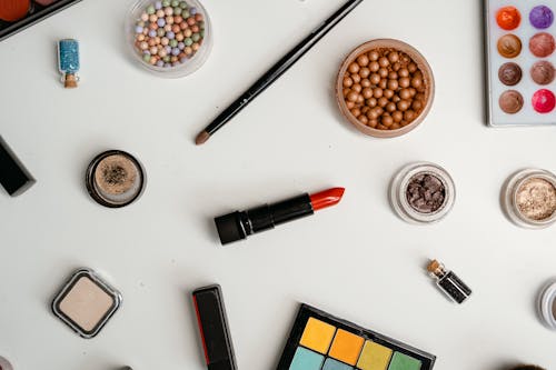 Beauty and Make Up Products on White Table