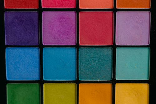 Free A close-up of a vibrant and colorful eye shadow palette featuring multiple shades, perfect for makeup enthusiasts. Stock Photo