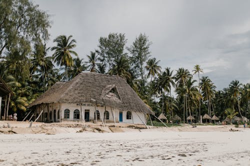 Small hut on sandy seashore