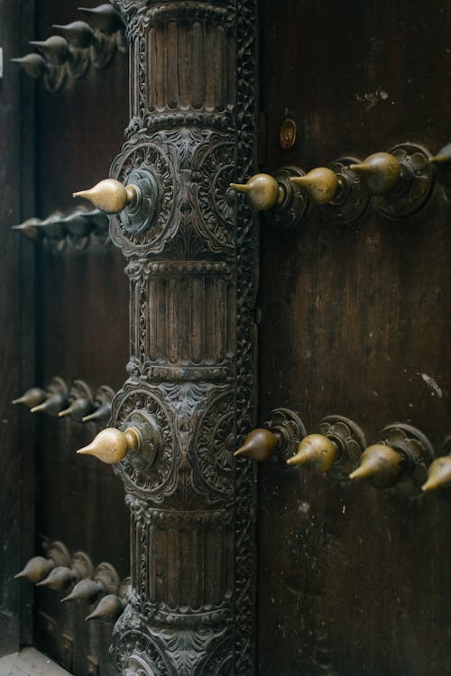 Free Detail of metal decorations on weathered door of ancient building in old city Stock Photo