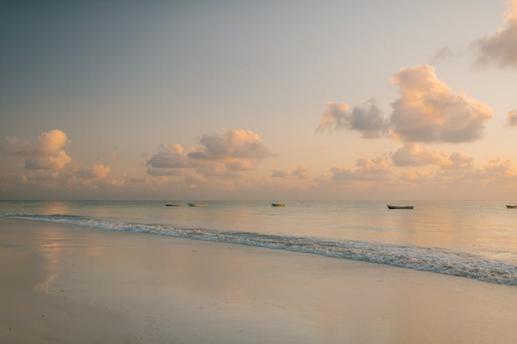 Row Of Fishing Boats On Clear Sea