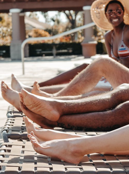 Free People's Legs on Sun Loungers Stock Photo