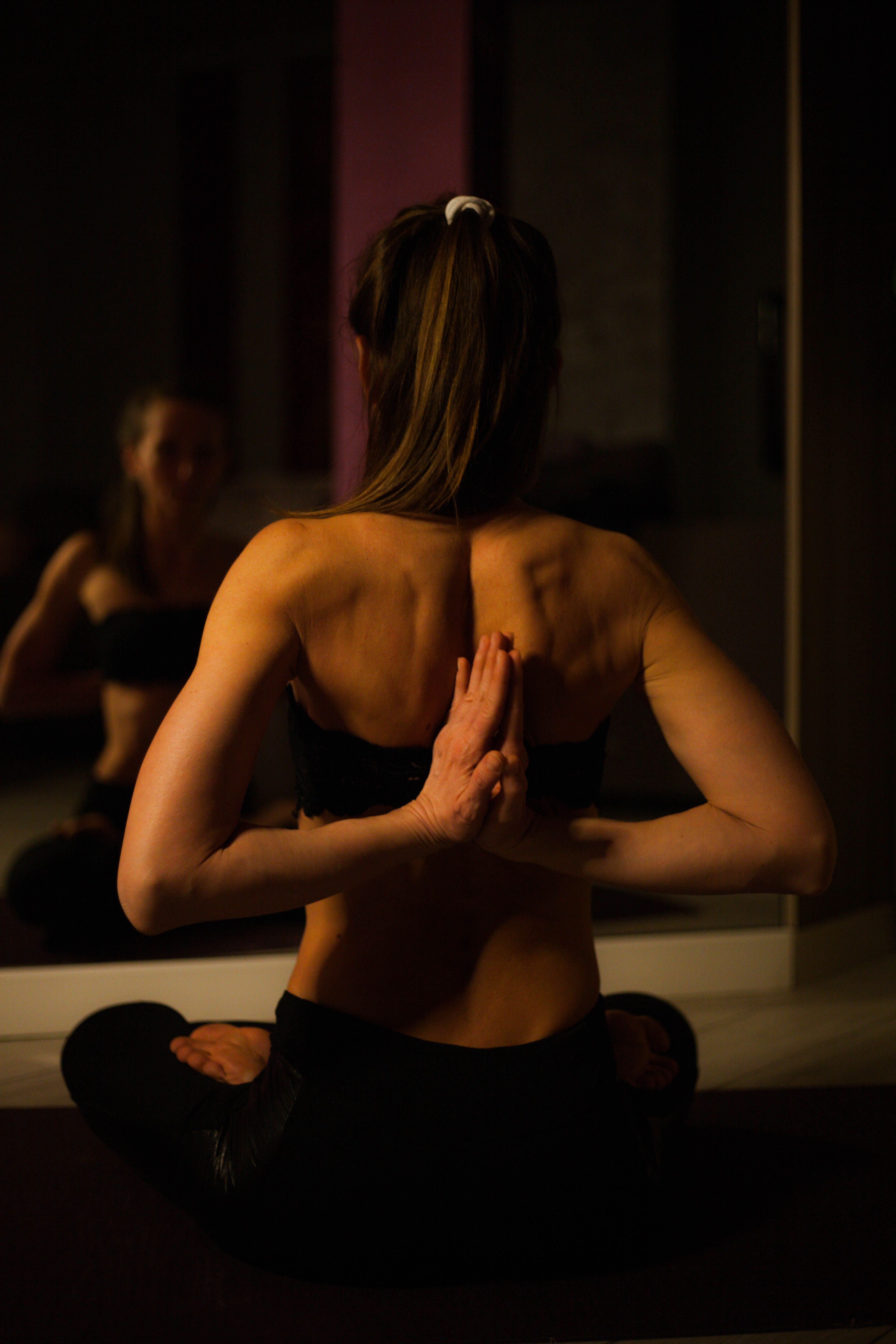 Woman in reverse prayer yoga pose