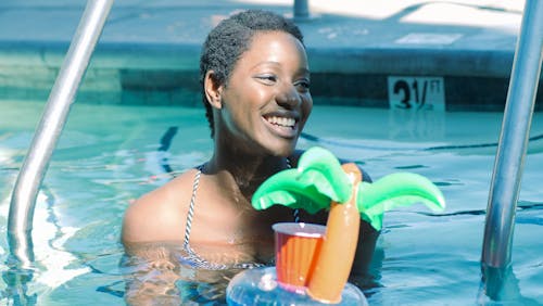 Woman Smiling in the Swimming Pool