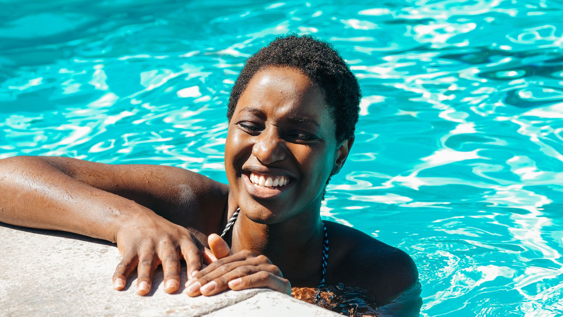 Woman Smiling in the Swimming Pool