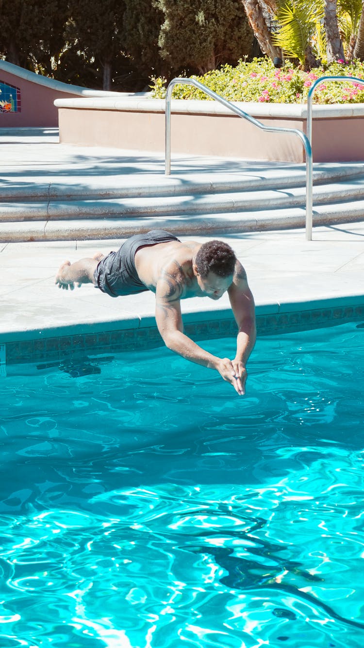 Man Plunging Into The Pool