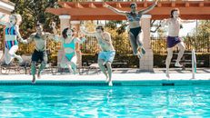 People Plunging into the Pool