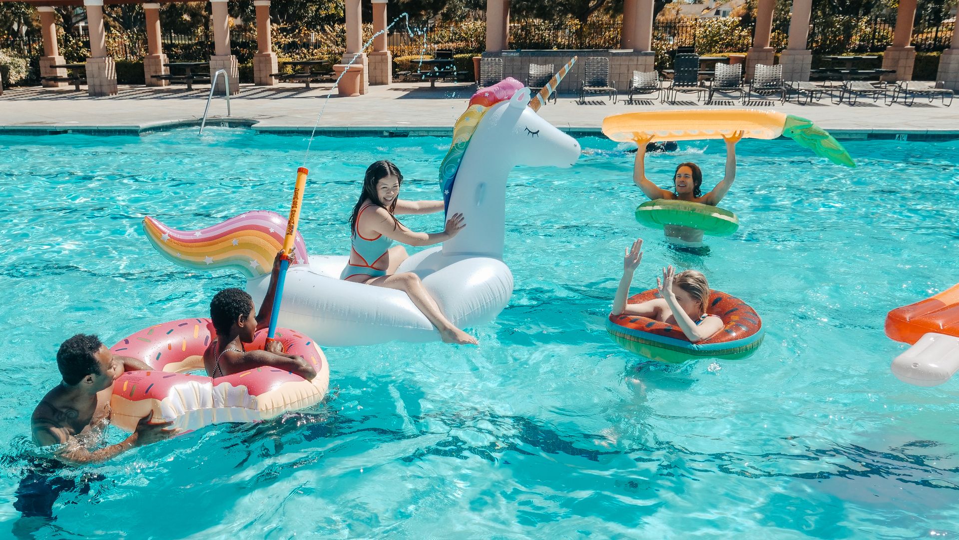 People Having Fun in the Swimming Pool